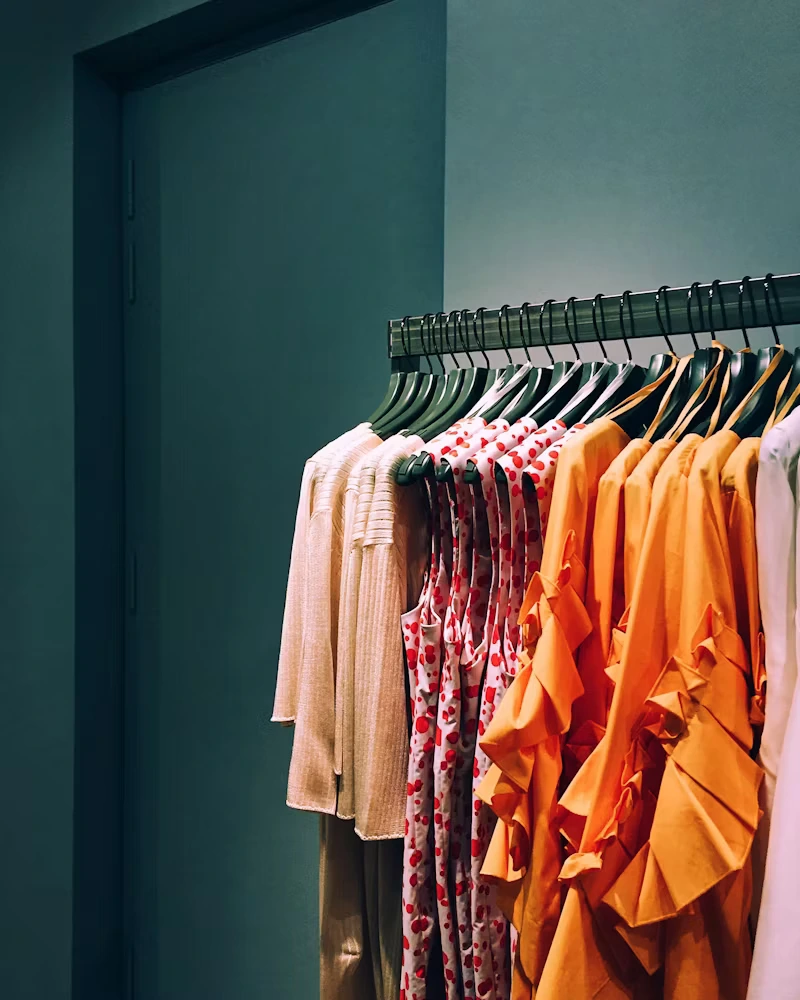 Three different types of tops on a hanger